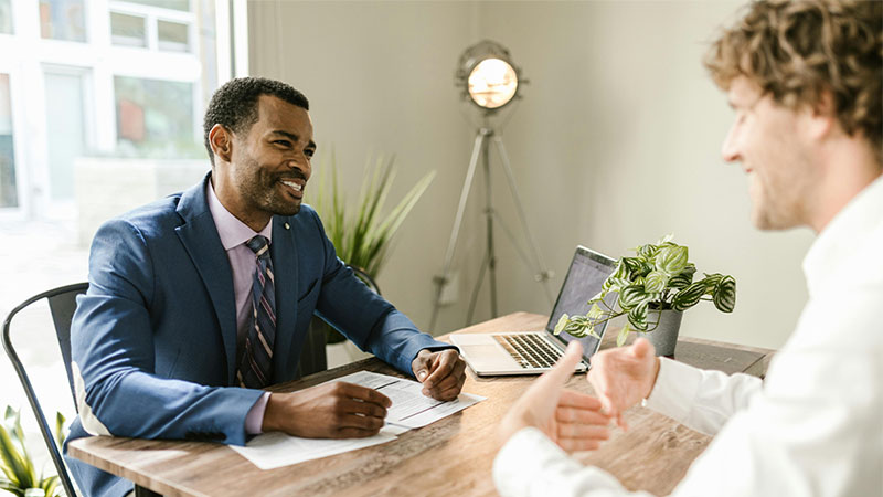 Two men discussing business